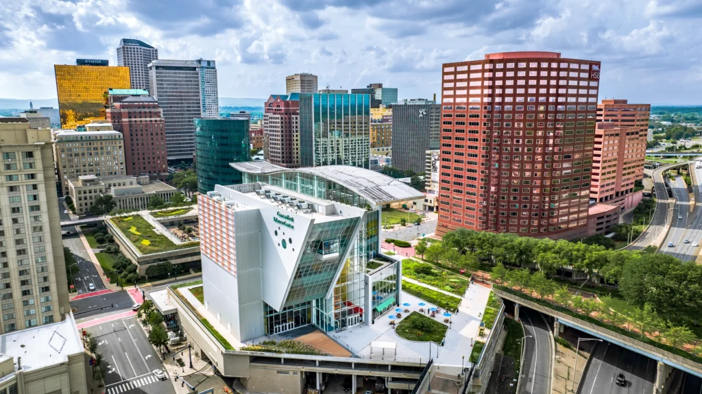Aerial view of downtown Hartford, Connecticut, featuring the Connecticut Science Center and surrounding high-rise buildings.