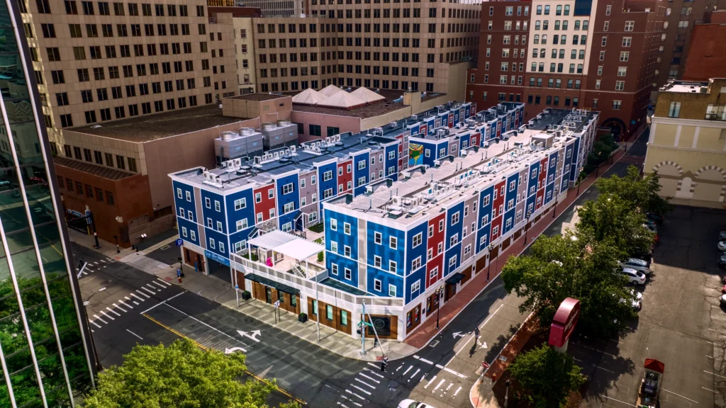 Aerial view of the Sage-Allen Apartments and newer townhouse additions near 21 Temple Street in downtown Hartford, Connecticut.