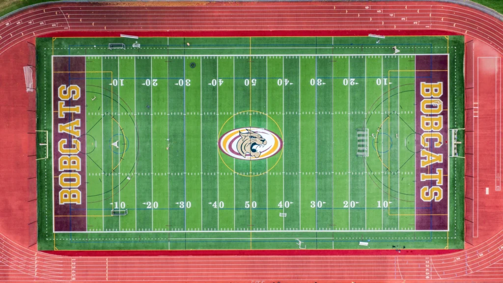 Straight-down aerial view of the South Windsor High School football field and surrounding running track in South Windsor, Connecticut.
