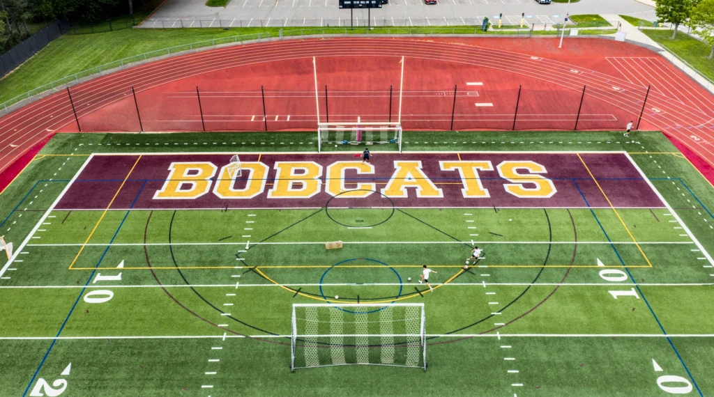 Aerial view of soccer players practicing on the athletic field at South Windsor High School in South Windsor, Connecticut.